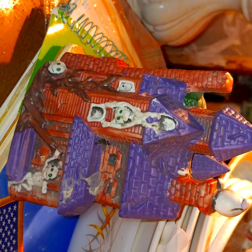 Vintage haunted house, lights up with bulb.
